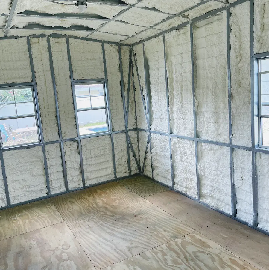 Closed-cell spray foam insulation applied to wall cavities in a residential project in Carson